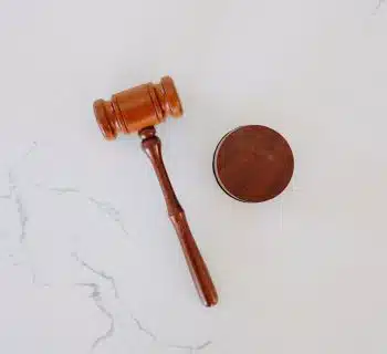brown wooden smoking pipe on white surface