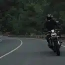 man riding motorcycle on concrete street